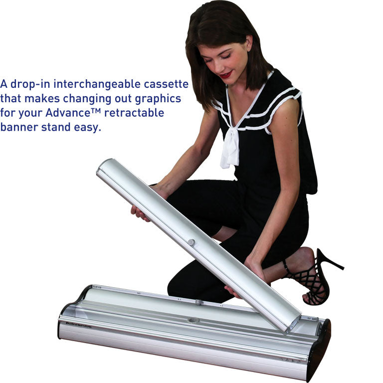 Woman changing a drop-in interchangeable cassette into an Advance™ Retractable Banner Stand. - Epic Displays